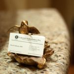 Interior photo: Frisco TX Endodontics business card in brass holder: Lakeside Endodontics